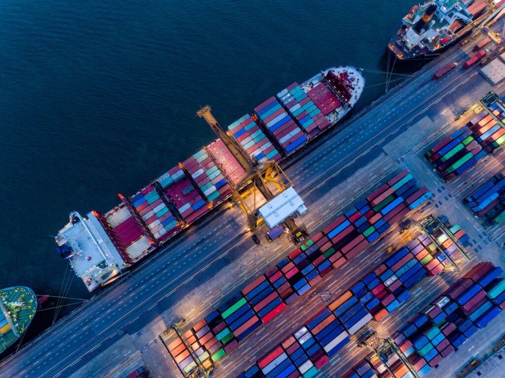Aerial view of international port with Crane loading containers