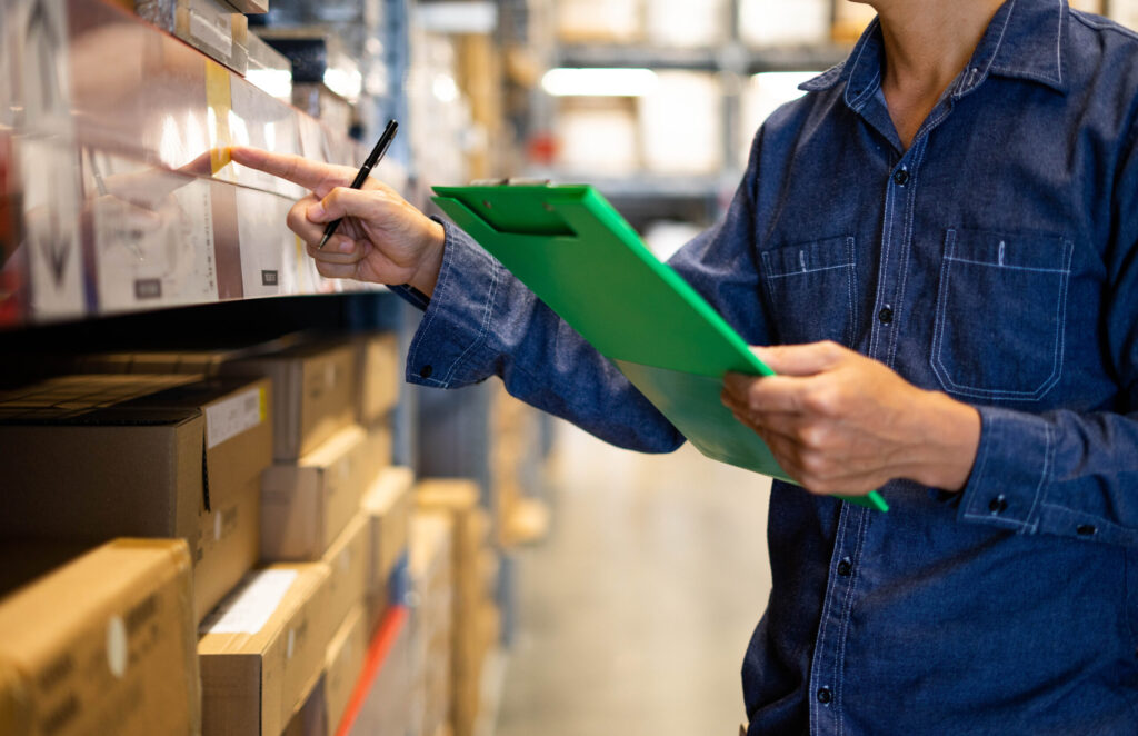 Manager man worker doing stocktaking of product management in ca